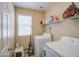 Functional laundry room with washer, dryer and storage shelves at 7242 S 48Th Gln, Laveen, AZ 85339
