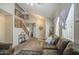 Spacious living room with soaring ceilings, lots of natural light, and a comfortable seating area at 7242 S 48Th Gln, Laveen, AZ 85339