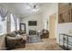 Cozy living room with plush seating, carpet flooring, and bright, natural light at 7242 S 48Th Gln, Laveen, AZ 85339