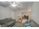 Comfortable living room area with neutral walls and plush seating, ideal for relaxing and entertaining at 7242 S 48Th Gln, Laveen, AZ 85339