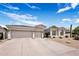 Lovely single-story home featuring desert landscaping, three-car garage and a tile roof at 7492 E Buteo Dr, Scottsdale, AZ 85255