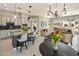 Open-concept kitchen with an island, white cabinets and a view of the living room at 7492 E Buteo Dr, Scottsdale, AZ 85255