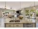 Kitchen with a granite island, modern appliances, and a connected living space at 7492 E Buteo Dr, Scottsdale, AZ 85255