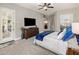 Bright main bedroom features ensuite access to the laundry room, and a large dresser at 7492 E Buteo Dr, Scottsdale, AZ 85255