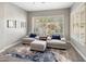 Comfortable sitting area with plush armchairs, a cozy ottoman, and natural light streaming through the shuttered windows at 7492 E Buteo Dr, Scottsdale, AZ 85255