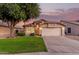 Charming single-Gathering home with a well-maintained lawn, mature tree, and two-car garage at 8319 E Plata Ave, Mesa, AZ 85212