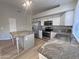 Modern kitchen with granite counters, stainless steel appliances, and ample counter space at 8319 E Plata Ave, Mesa, AZ 85212