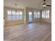 Cozy breakfast nook area with wood floors, plantation shutters and a glass door to the backyard at 8319 E Plata Ave, Mesa, AZ 85212