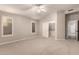 Cozy bedroom featuring a walk-in closet, neutral walls and a ceiling fan at 8319 E Plata Ave, Mesa, AZ 85212