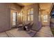 Relaxing covered patio with textured stucco and seating at 8319 E Plata Ave, Mesa, AZ 85212