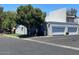 Exterior shot of a home featuring a two-car garage and mature trees at 8702 N Shadow Ln, Peoria, AZ 85345