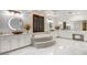 Opulent bathroom featuring dual vanities, a step-up soaking tub, and marble flooring at 921 E Canyon Way, Chandler, AZ 85249