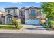 Beautiful home featuring mature landscaping, a three car garage, and stone accents on the front elevation at 921 E Canyon Way, Chandler, AZ 85249