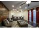 Spacious living room with plush seating, a decorative wall, and large windows for natural light at 921 E Canyon Way, Chandler, AZ 85249