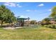 Community playground area surrounded by lush green grass and trees, a perfect place to spend the afternoon at 921 E Canyon Way, Chandler, AZ 85249