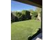 Spacious backyard with well-maintained artificial grass, perfect for outdoor activities at 9726 E Butte St, Mesa, AZ 85207