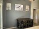 Cozy dining area with a wooden table, chairs, and stylish horse-themed wall art at 9726 E Butte St, Mesa, AZ 85207