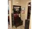 Entryway with coat rack, mirror, and storage bench at 9726 E Butte St, Mesa, AZ 85207