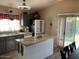 Bright kitchen features a marble island and stainless steel appliances at 9726 E Butte St, Mesa, AZ 85207