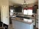 Well-equipped kitchen with granite countertops, subway tile backsplash, and modern appliances at 9726 E Butte St, Mesa, AZ 85207