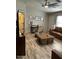 Cozy living room featuring hardwood floors, comfortable seating, and a ceiling fan at 9726 E Butte St, Mesa, AZ 85207