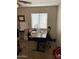 Comfortable home office setup featuring an adjustable desk, monitor and comfortable chair at 9726 E Butte St, Mesa, AZ 85207
