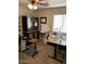 Spacious home office setup with dual desks, white board, and cabinet at 9726 E Butte St, Mesa, AZ 85207
