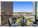 Relaxing balcony with comfortable chairs and breathtaking views of the city skyline at 1 E Lexington Ave # 1209, Phoenix, AZ 85012
