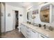 Elegant bathroom with double sinks, quartz countertops, and stylish fixtures at 1 E Lexington Ave # 1209, Phoenix, AZ 85012