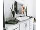 Bright, minimalist bathroom with modern fixtures, a vessel sink, and stylish decor at 1 E Lexington Ave # 1209, Phoenix, AZ 85012