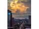 Scenic city view with dramatic clouds and distant mountains, featuring nearby buildings at 1 E Lexington Ave # 1209, Phoenix, AZ 85012