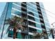 Modern high-rise building with floor-to-ceiling windows and balconies with palm trees at 1 E Lexington Ave # 1209, Phoenix, AZ 85012