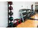 Bright gym featuring free weights, medicine balls, and a mirrored wall at 1 E Lexington Ave # 1209, Phoenix, AZ 85012