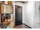 Hallway with dark wooden door and stylish shelving that reads 'today will be awesome.' at 1 E Lexington Ave # 1209, Phoenix, AZ 85012