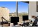 Bright home office setup with stunning mountain views through a large window at 1 E Lexington Ave # 1209, Phoenix, AZ 85012