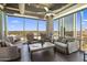 Bright living room with modern furnishings and large windows offering panoramic city views at 1 E Lexington Ave # 1209, Phoenix, AZ 85012
