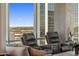 Inviting space with comfortable seating and city views through large windows, creating a bright and open atmosphere at 1 E Lexington Ave # 1209, Phoenix, AZ 85012