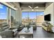 Inviting living room featuring comfortable recliners, modern decor, and stunning city views at 1 E Lexington Ave # 1209, Phoenix, AZ 85012