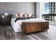 Comfortable bedroom featuring stylish decor, wood floors, and plenty of natural light at 1 E Lexington Ave # 1209, Phoenix, AZ 85012