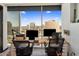 This home office boasts panoramic city views, a spacious desk setup, and plenty of natural light at 1 E Lexington Ave # 1209, Phoenix, AZ 85012