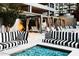 Outdoor lounge area with modern seating around a cozy fire feature by the pool at 1 E Lexington Ave # 1209, Phoenix, AZ 85012