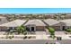 Expansive aerial view of a suburban neighborhood showcasing similar single-Gathering homes and well-manicured yards at 10029 E Wavelength Ave, Mesa, AZ 85212