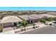 Aerial view of a well-maintained neighborhood with single-Gathering homes and landscaped yards at 10029 E Wavelength Ave, Mesa, AZ 85212
