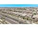 A high-angle view capturing a neighborhood featuring single-story homes with desert landscaping and paved roads at 10029 E Wavelength Ave, Mesa, AZ 85212