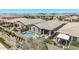An aerial view of a house with a pool and an outdoor living area at 10029 E Wavelength Ave, Mesa, AZ 85212