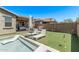 Wonderful backyard featuring a pool, a patio with outdoor seating, and artificial grass at 10029 E Wavelength Ave, Mesa, AZ 85212