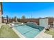 Backyard pool with seating areas, turf, decorative wall and outdoor grill at 10029 E Wavelength Ave, Mesa, AZ 85212