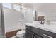 Well-lit bathroom features a shower-tub combo and modern vanity at 10029 E Wavelength Ave, Mesa, AZ 85212