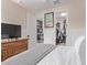 Bedroom featuring a walk-in closet and adjacent office space at 10029 E Wavelength Ave, Mesa, AZ 85212