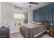 Comfortable bedroom with abundant natural light and stylish decor at 10029 E Wavelength Ave, Mesa, AZ 85212